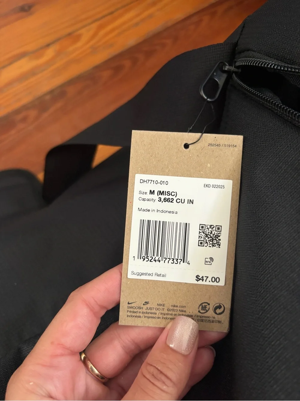 Nike Black Duffel Bag with White Swoosh and Strap Logo